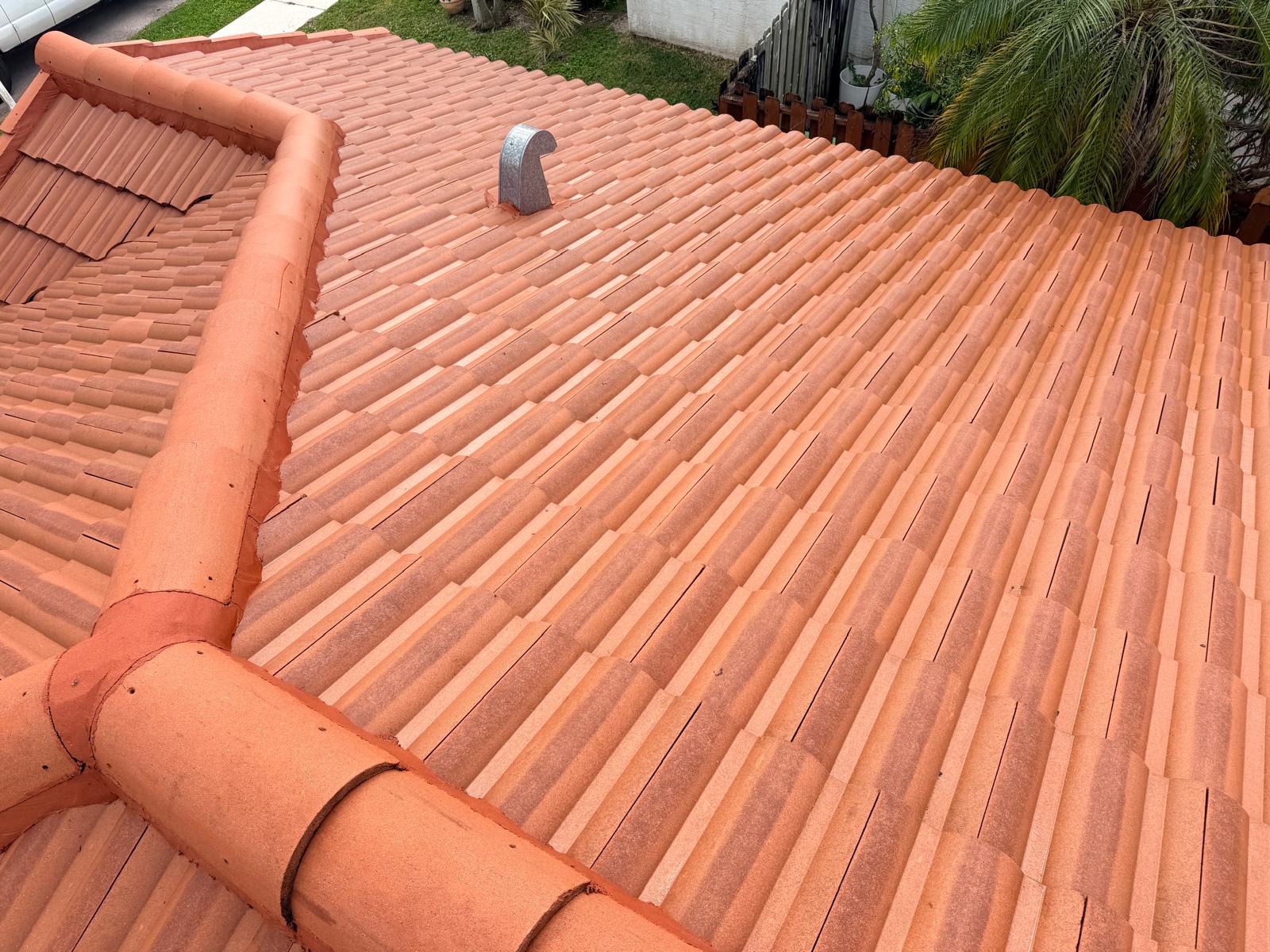 Roof after soft-wash pressure cleaning — clean, bright terracotta tile roof restored to like-new condition